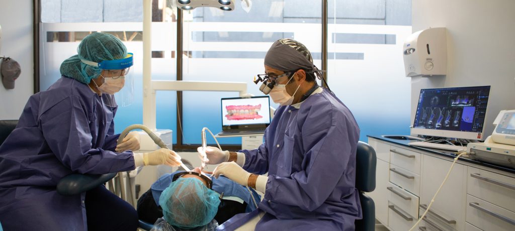 prosthodontist working on a patient