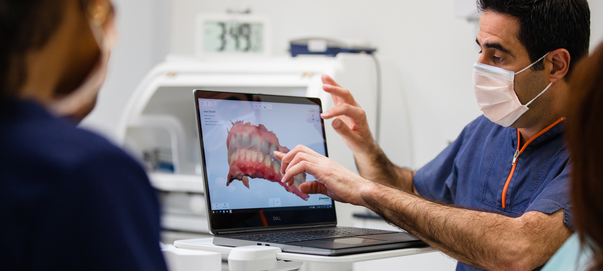 Dr. Obeid showing a patient images on computer